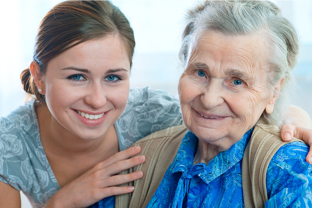 Nurse caring for elderly patient